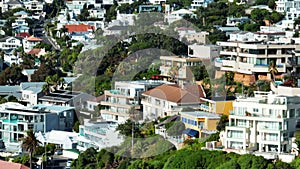 Slider of buildings in residential borough. Guesthouses and apartments in tropical destination on sunny day. Cape Town