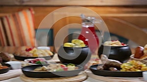 Slider panorama of fresh hot potato dishes in the morning countryside beautifully laid table