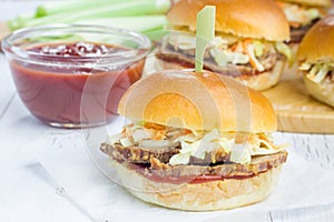 Sliders with beef brisket, barbecue sauce and coleslaw