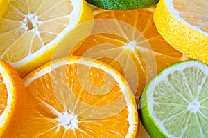 Slides of oranges, citrons and limes. photo