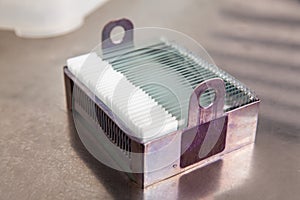 Slides with paraffin embedded tissue samples into a slide staining rack. Fluorescent Immunohistochemistry staining of paraffin- photo