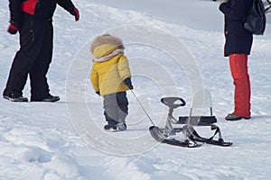 The independent child on a snow slope photo