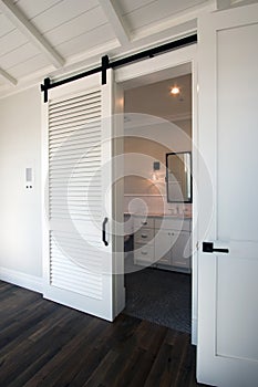 Interior sliding barn doors into bathroom