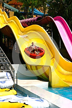 Sliding down the big slide.