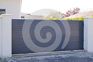 Sliding gate steel big dark grey metal portal fence gray slide on modern house street