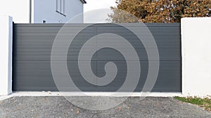 Sliding gate steel large grey metal portal fence on modern house street