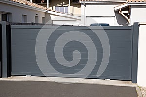 Sliding portal gray high large metal gate grey fence on modern suburb street house door