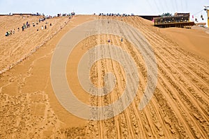 Sliding sand, desert tourism background