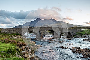 Sligachan Old Bridge and The Cuillins, Isle of Skye at sunset photo