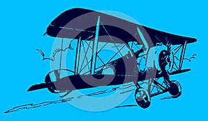 Slightly ascending historic biplane in fromt of a cloudy and sunny sky on a blue background