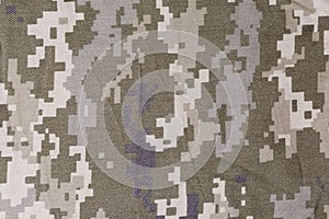 Slightly crumpled fabric with digital camouflage pattern close-up, background photo
