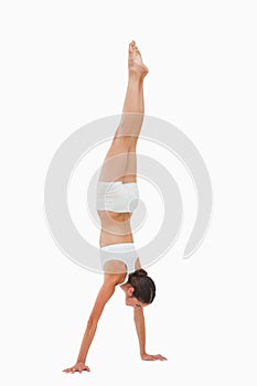 Slim brunette handstands