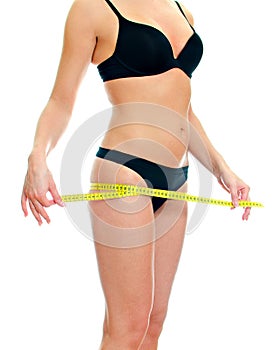 Slim female body with measure tape