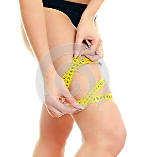 Slim female body with measure tape