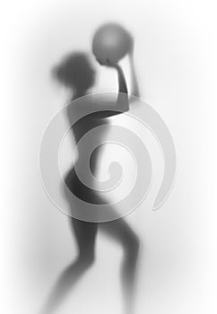 Slim female body silhouette with basket ball