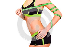 Slim figure of girl with a centimetre ribbon on a hand photo