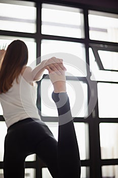 Slim girl doing gymnastic exercises