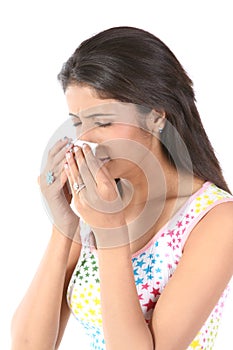 Slim girl sneezing with tissue paper