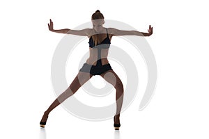 Slim go-go dancer performing on white background