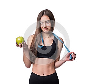 Slim and healthy young woman holding measure tape and apple isolated on white background. Weight loss and diet concept.