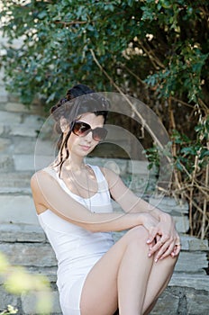 slim lady wear tight short white dress and sunglasses