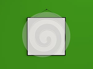 Slim square blank photo frame on composition on green back