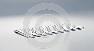 Slim, wireless computer keyboard with a minimalist design. The keyboard features a