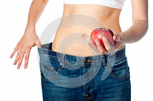 Slim woman holding apple