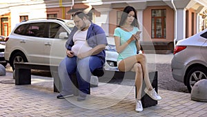 Slim woman ignoring overweight man, social rejection, obesity prejudices, health