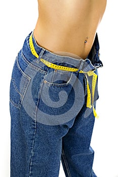 Slim woman measuring her waist