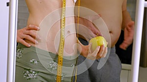 Slim woman measuring his waist, healthy eating, healthy lifestyle concept, fitness diet