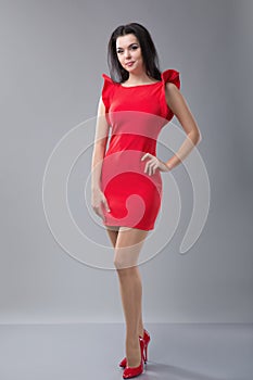 slim woman in red dress