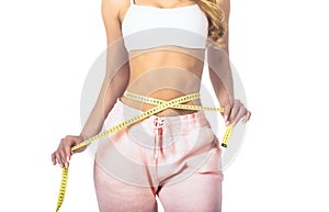 Slim woman& x27;s body. Woman with measuring tape. Weight loss concept. Woman take waist scale tape show her thin waist