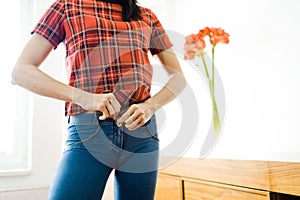 Slim woman wearing blue stretch jeans