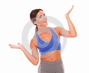 Slim young woman raising both palms with vitality