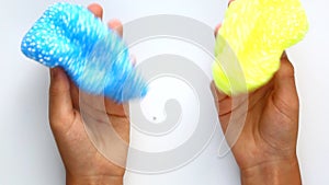 Slime blue and yellow. Foam slime with foam balls