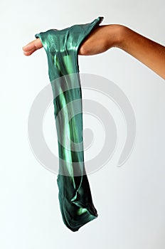 Slime elastic and viscous on child`s hand photo