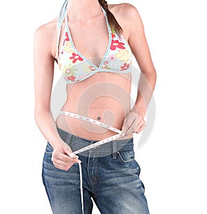 Slimming woman measuring her waist