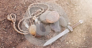 The Sling of David with Five Smooth Stones and Goliaths Sword