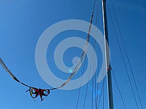 Slingshot attraction on the top of Tahtali mountan with cloudy blue sky background