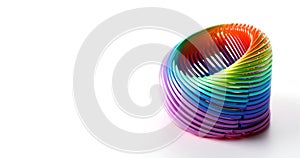 Slinky toy. Plastic spring isolated on white background. Bright spiral spring