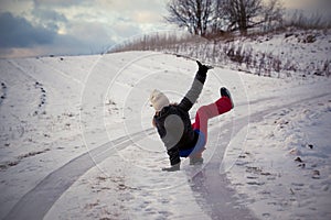 Slip on the slippery ice and snow on the road track at the country in freezing winter day