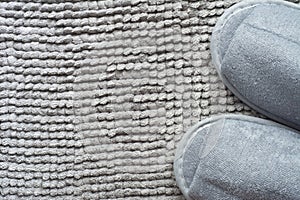 Slipper on gray carpet