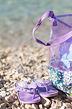 Slippers and bag at beach and summer season