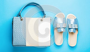 Slippers on a blue background. Slippers for the summer. Ladies bag and stylish blue shoes. Stylish blue women's leather