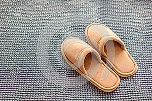 Slippers on the soft rug, the concept of comfort
