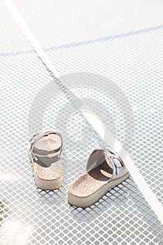 Slippers on white fence background yacht