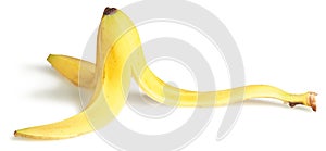 Slippery banana skin on a white background