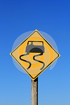 Slippery road sign photo