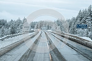 Slippery snowy Northern winter road, turn on the road. Kola Peninsula